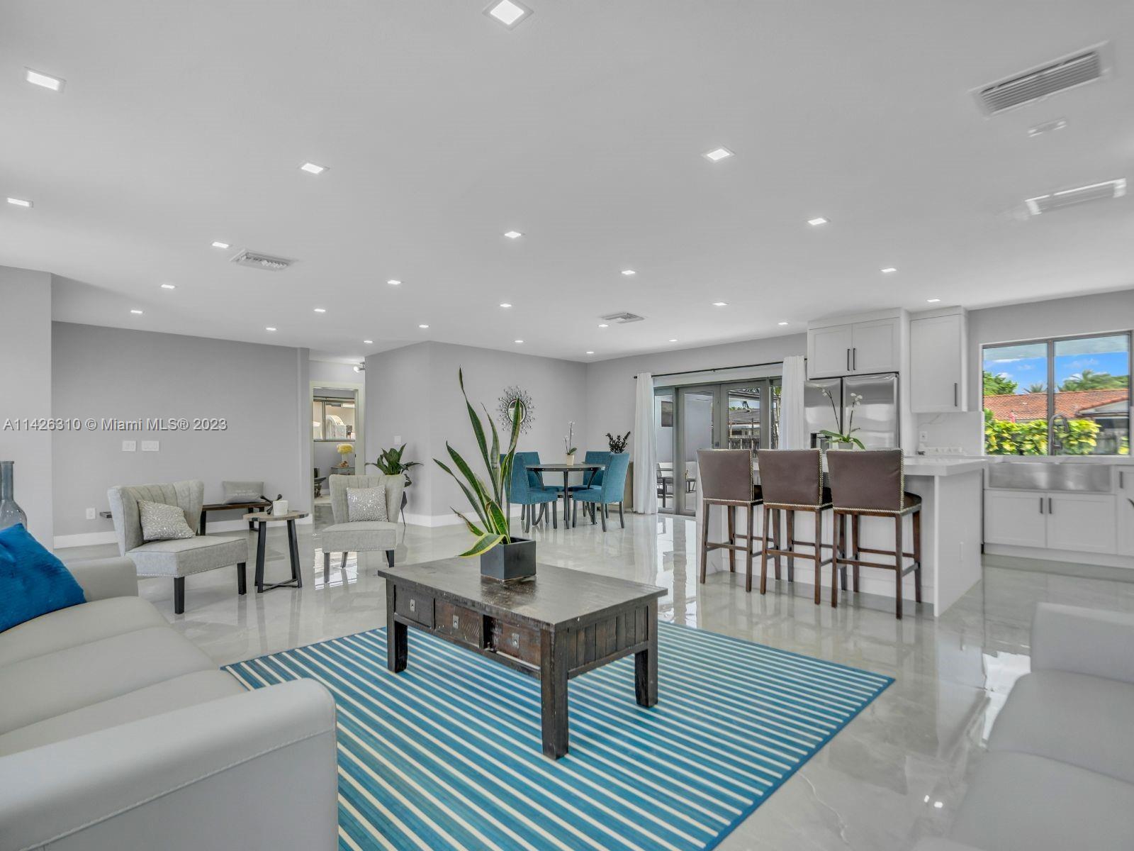 9670 Southwest 17th Street Miami, FL 33165 - Photo 5 of 17 a living room with furniture and a wooden floor