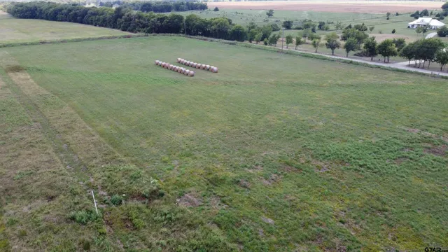 a view of a road with a yard