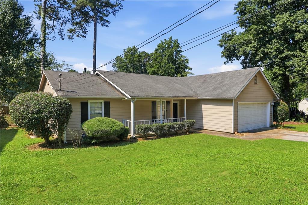 5288 Biffle Downs Road Stone Mountain, GA 30088 - Photo 1 of 18 a view of a house with a yard and potted plants