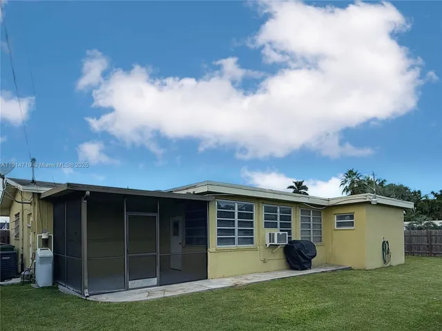 a view of a back yard of the house