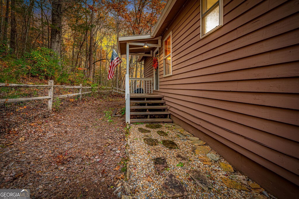 90 Hay Lane Morganton, GA 30560 - Photo 4 of 77 a view of a backyard with stairs and wooden fence