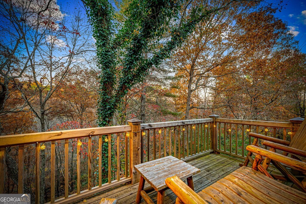 90 Hay Lane Morganton, GA 30560 - Photo 50 of 77 a view of a wooden deck with a bench