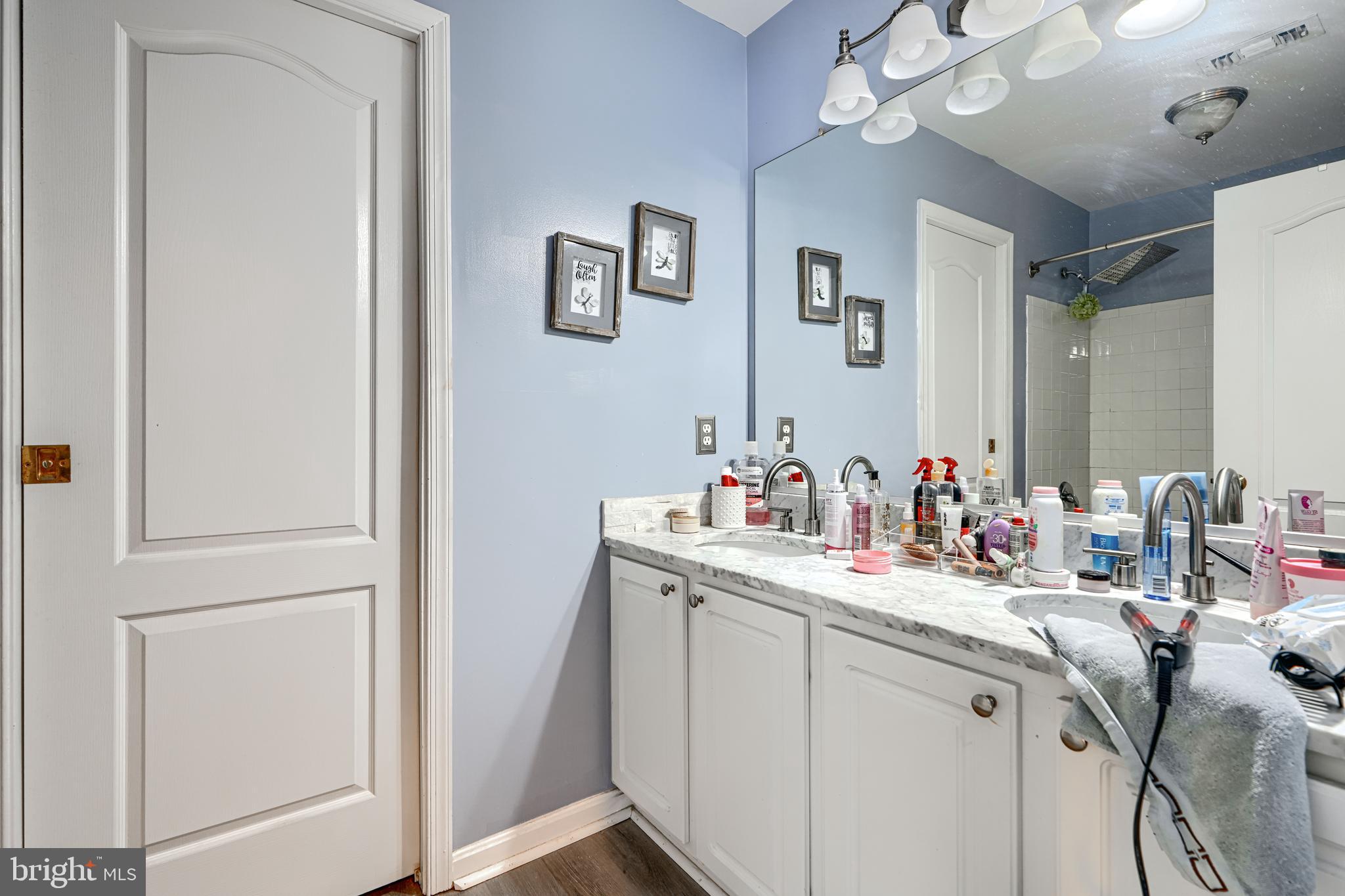 8113 Alan Tree Road Rosedale, MD 21237 - Photo 11 of 16 a bathroom with a sink vanity and mirror