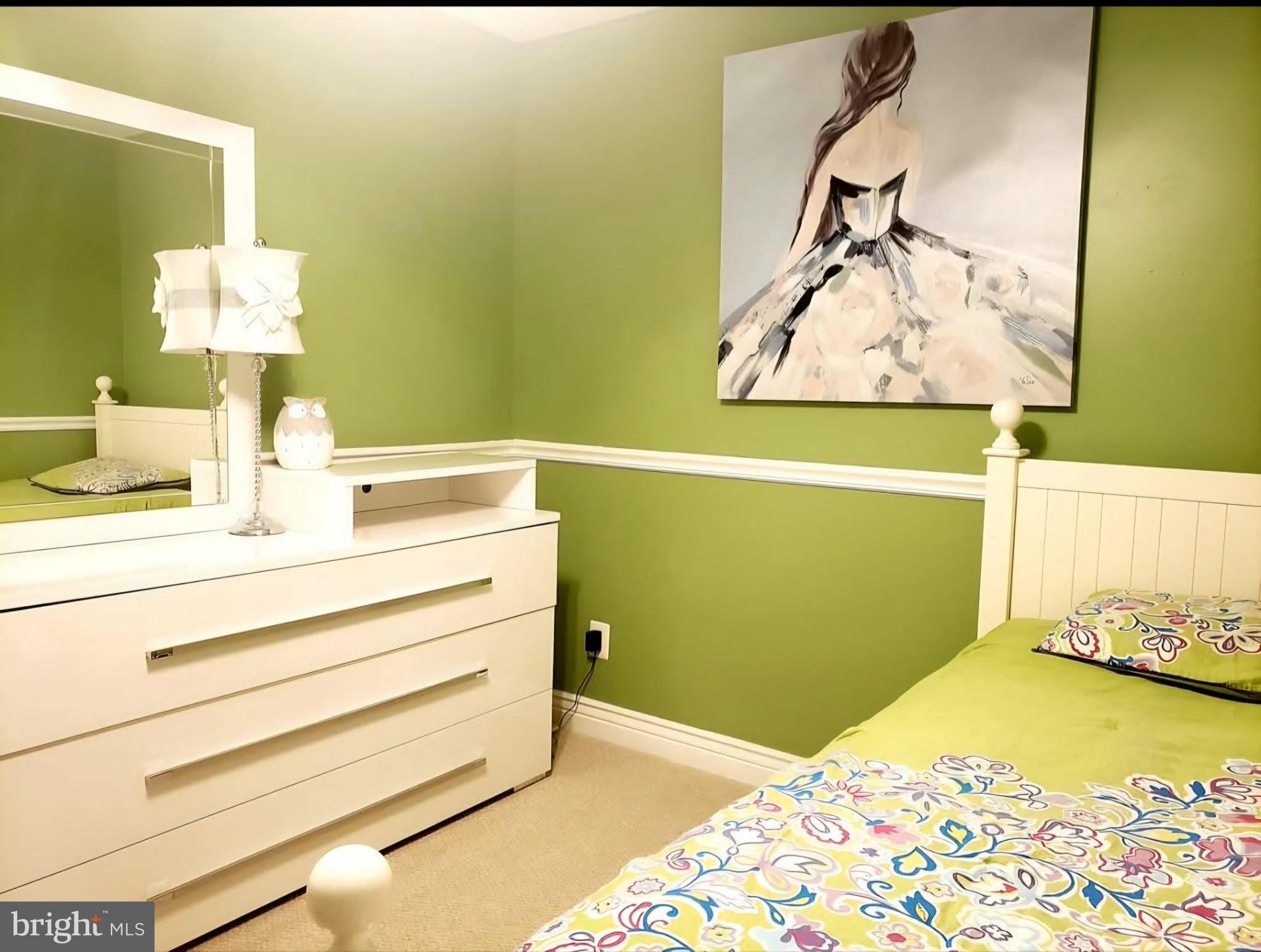 8113 Alan Tree Road Rosedale, MD 21237 - Photo 11 of 13 a bedroom with a bed and a painting on the wall