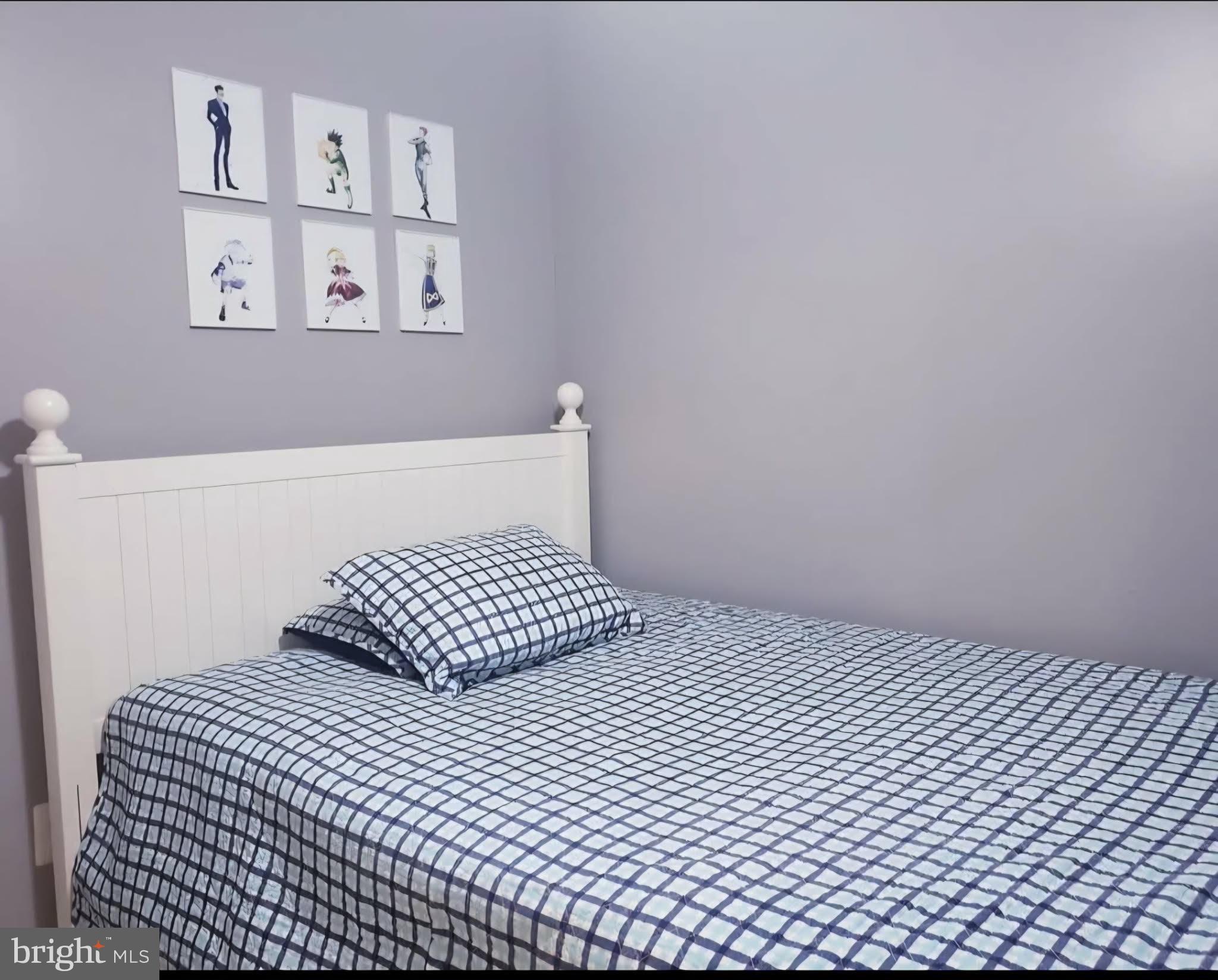 8113 Alan Tree Road Rosedale, MD 21237 - Photo 12 of 13 a bedroom with a bed