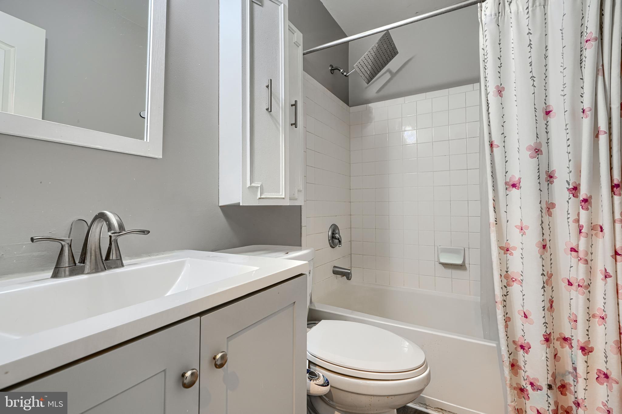 8113 Alan Tree Road Rosedale, MD 21237 - Photo 14 of 16 a bathroom with a sink toilet and shower