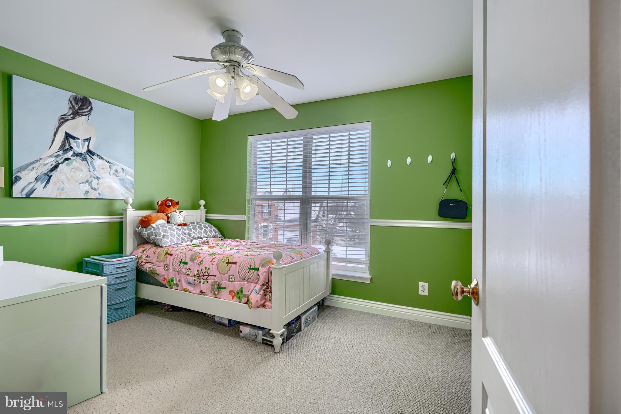 8113 Alan Tree Road Rosedale, MD 21237 - Photo 15 of 16 a bedroom with a bed and a window