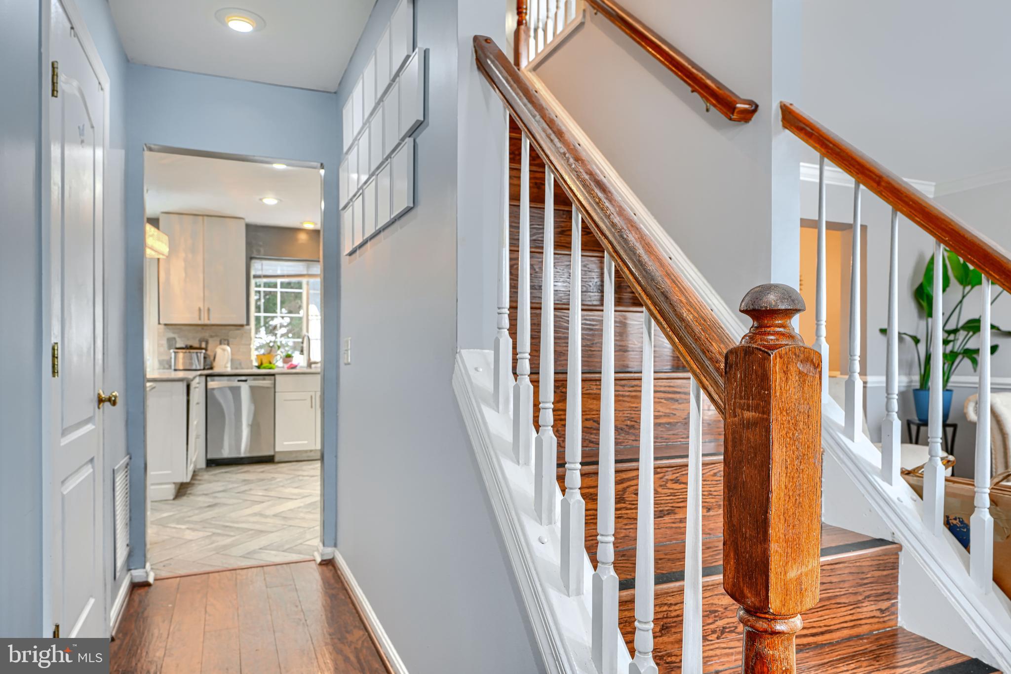 8113 Alan Tree Road Rosedale, MD 21237 - Photo 5 of 16 a view of a hallway with wooden floor and staircase