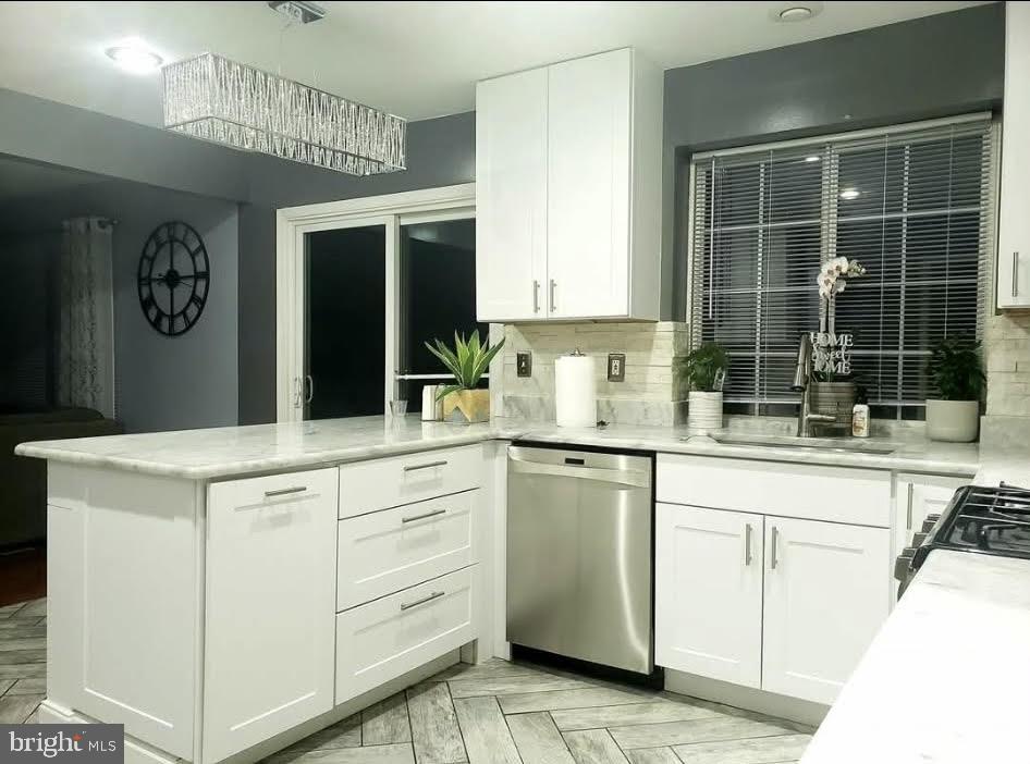 8113 Alan Tree Road Rosedale, MD 21237 - Photo 6 of 13 a kitchen with white cabinets and sink