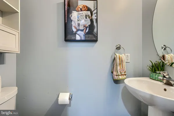 a bathroom with a toilet and a tub