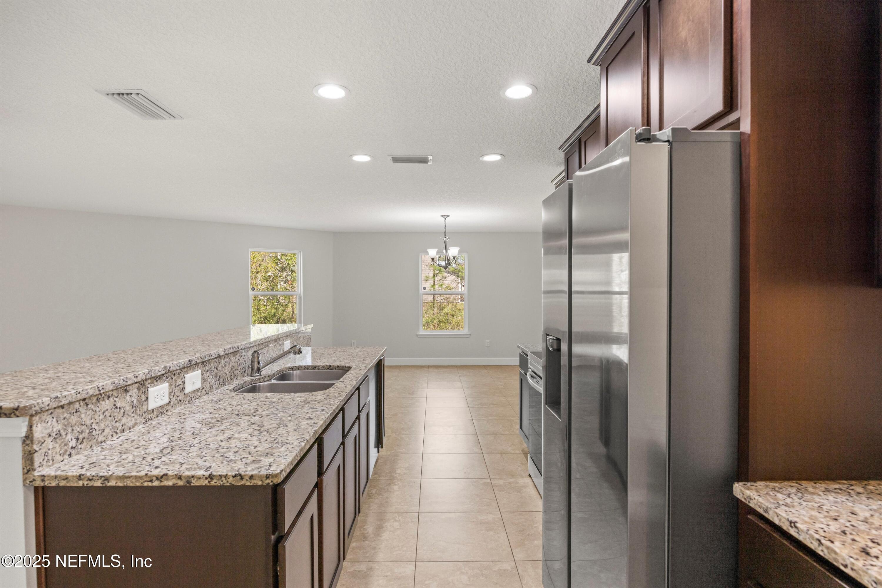 366 Old Jennings Road Orange Park, FL 32065 - Photo 15 of 40 a bathroom with a granite countertop sink a refrigerator and window