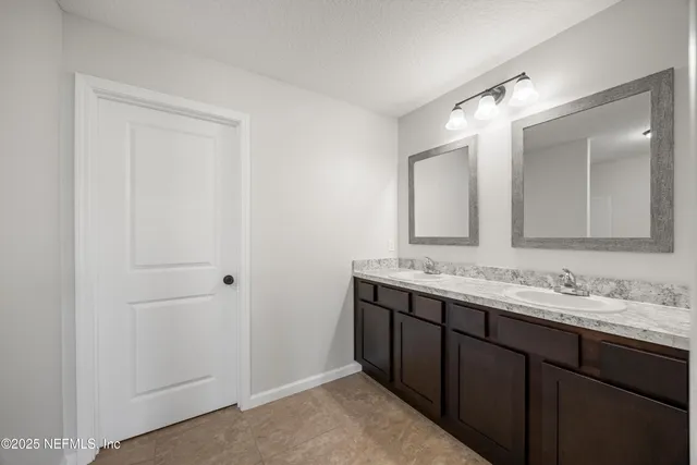 a white bath tub sitting next to a toilet