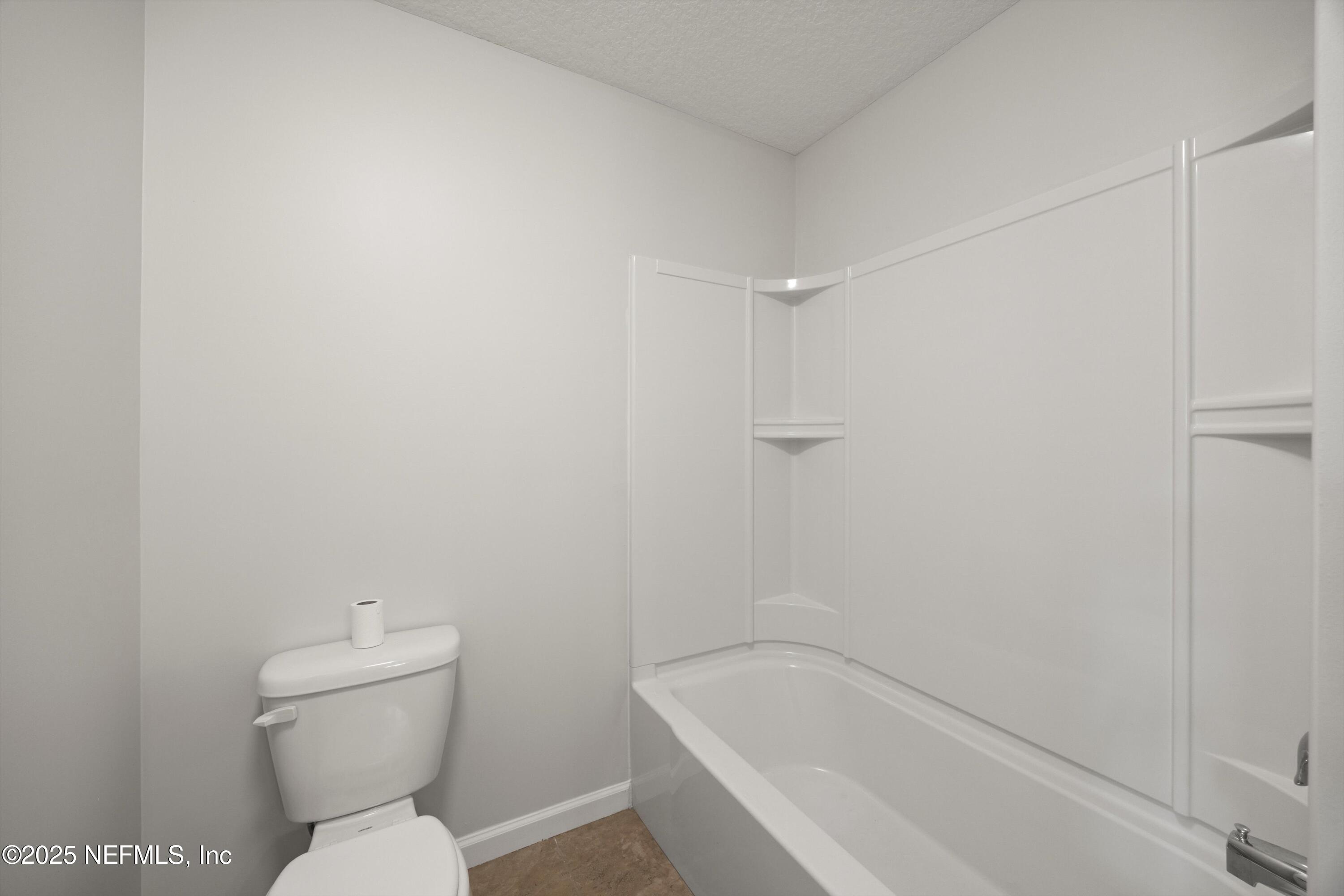 366 Old Jennings Road Orange Park, FL 32065 - Photo 23 of 40 a white bath tub sitting next to a toilet