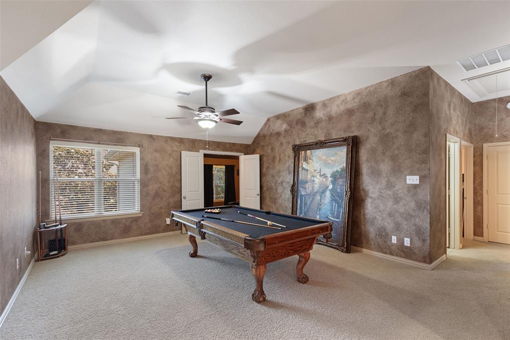 1217 Windmere Way Allen, TX 75013 - Photo 27 of 38 Designed for entertaining and everyday fun, the oversized game room offers endless possibilities for billiards, gaming, or a relaxed upstairs lounge space.