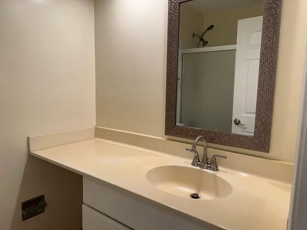 a bathroom with a sink and a mirror