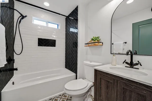 a view of a hallway with wooden floor and closet