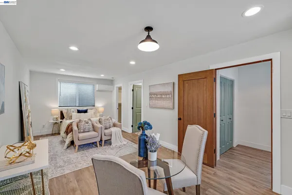 a view of a house with backyard and sitting area