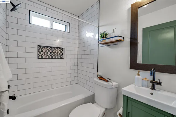 a picture of a bathroom with a window