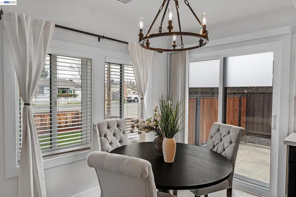 a kitchen with a table and chairs