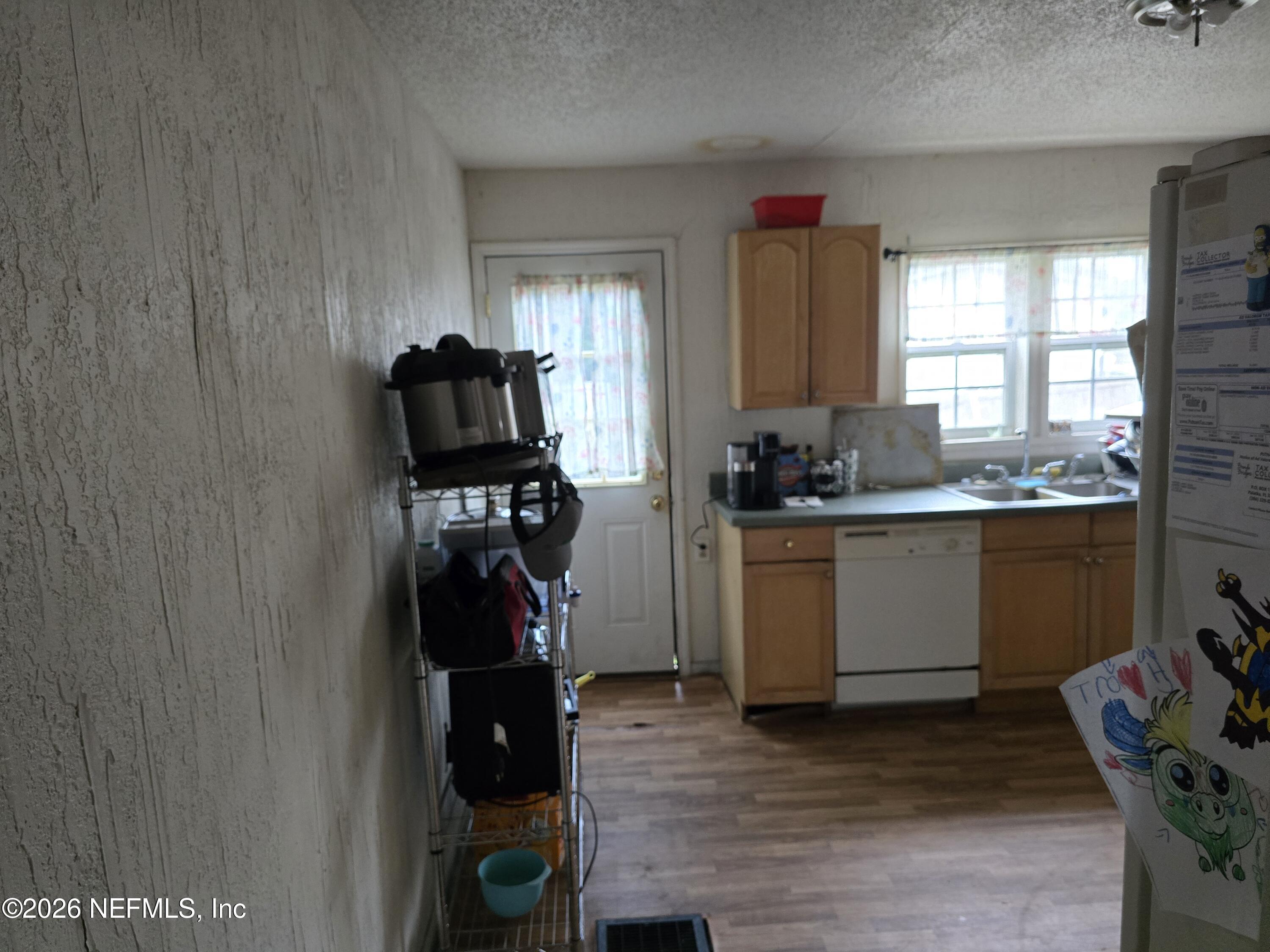 113 Tyre Road Interlachen, FL 32148 - Photo 14 of 15 a kitchen with a refrigerator and a stove top oven