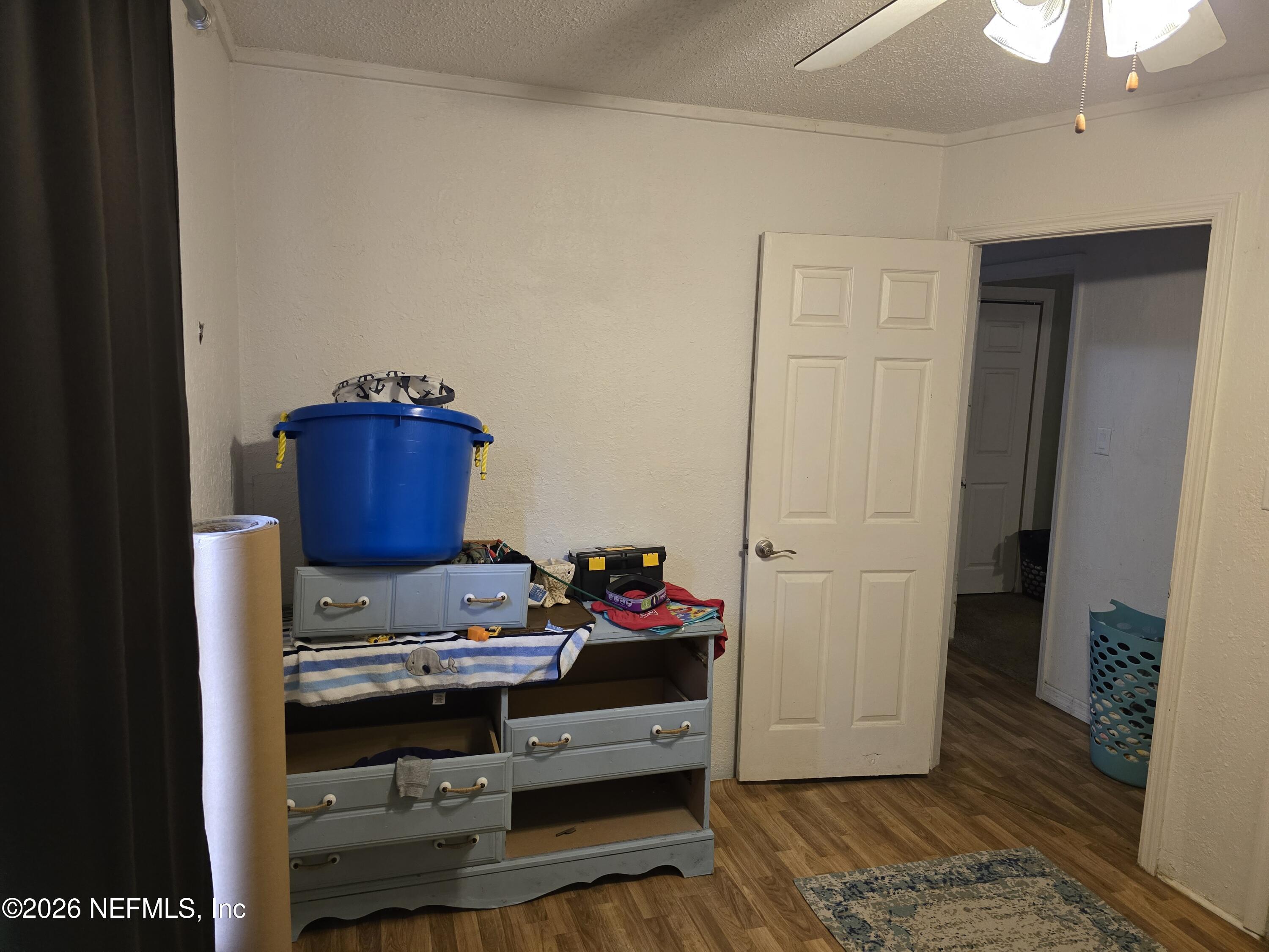 113 Tyre Road Interlachen, FL 32148 - Photo 10 of 15 a room with furniture and wooden floor