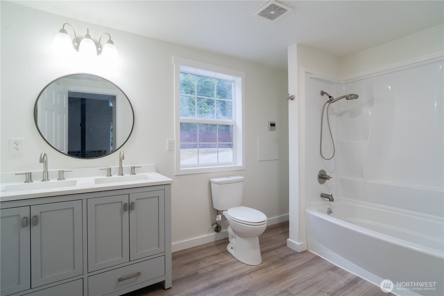 21405 Thompson Creek Road Southeast Tenino, WA 98589 - Photo 15 of 26 a bathroom with a toilet sink and mirror