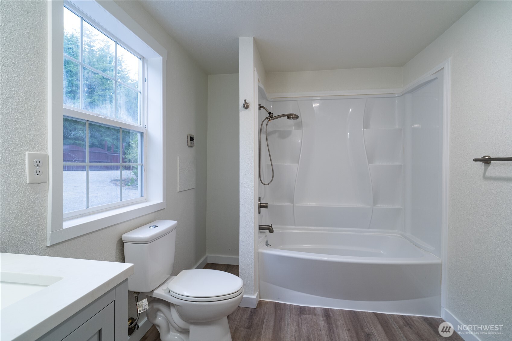21405 Thompson Creek Road Southeast Tenino, WA 98589 - Photo 16 of 26 a bathroom with a sink toilet and shower