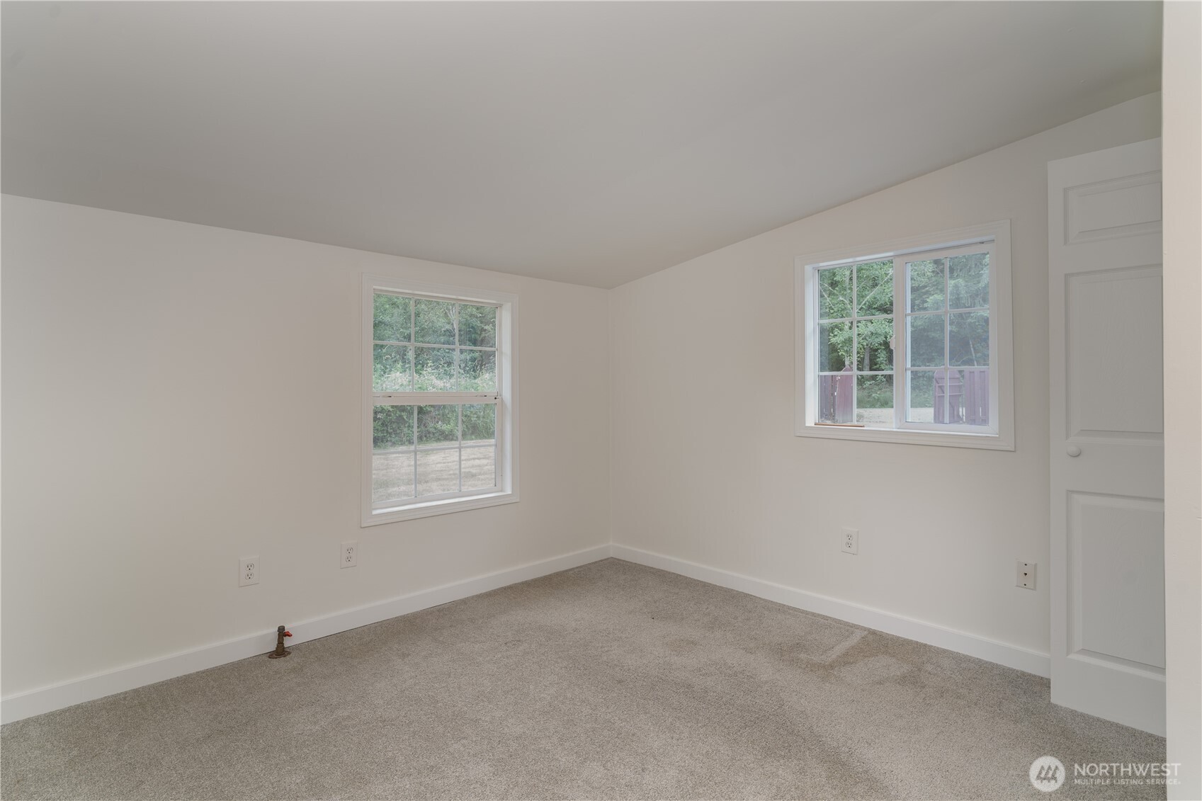 21405 Thompson Creek Road Southeast Tenino, WA 98589 - Photo 17 of 26 an empty room with a window
