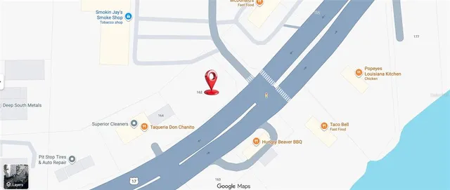 a view of a park with large trees