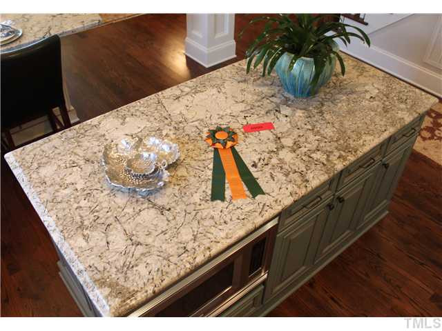 4908 Great Meadows Court Raleigh, NC 27609 - Photo 14 of 25 Level 5 Granite in awesome kitchen with large island. Kitchen