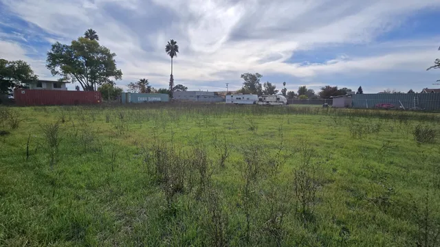 a view of a water fountain and a big yard