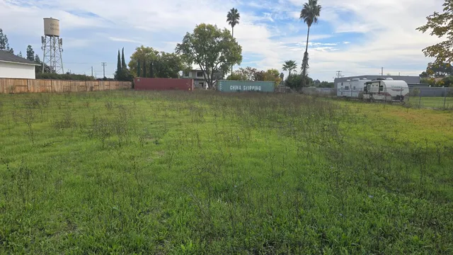 a view of a water with a yard
