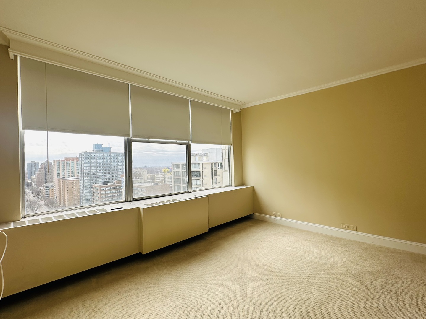 5757 North Sheridan Road, Unit 17H Chicago, IL 60660 - Photo 11 of 25 a view of an empty room with a window