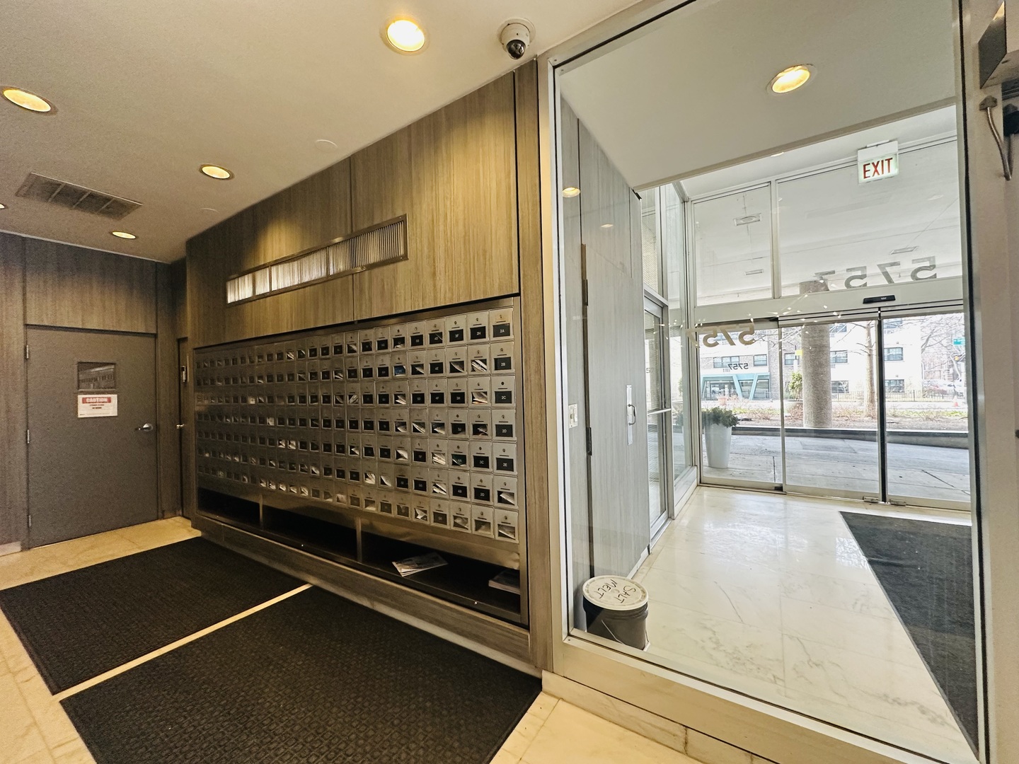5757 North Sheridan Road, Unit 17H Chicago, IL 60660 - Photo 2 of 25 a view of a hallway with wooden floor