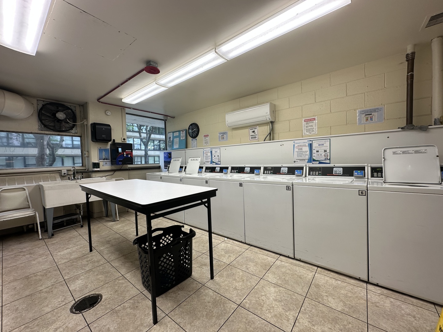 5757 North Sheridan Road, Unit 17H Chicago, IL 60660 - Photo 21 of 25 a kitchen with cabinets and chairs in it