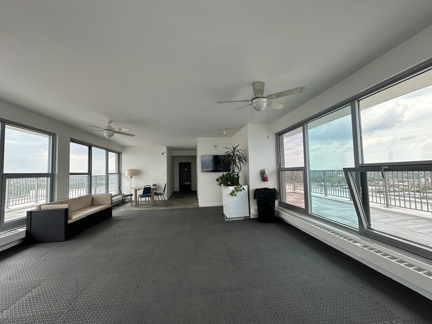 5757 North Sheridan Road, Unit 17H Chicago, IL 60660 - Photo 23 of 25 a living room with furniture and large windows