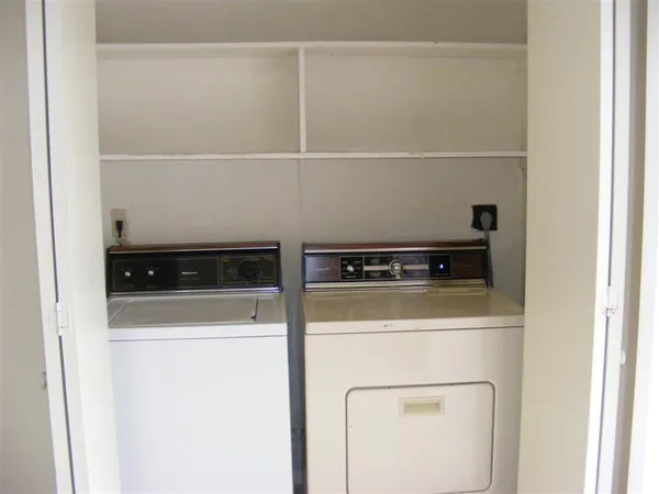 a view of a wooden door with a wooden deck