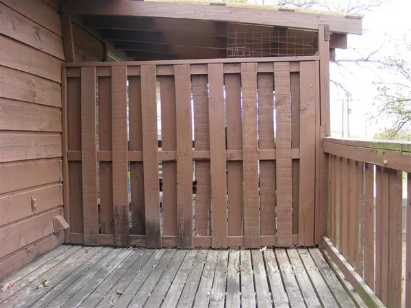 a view of wooden floor with staircase