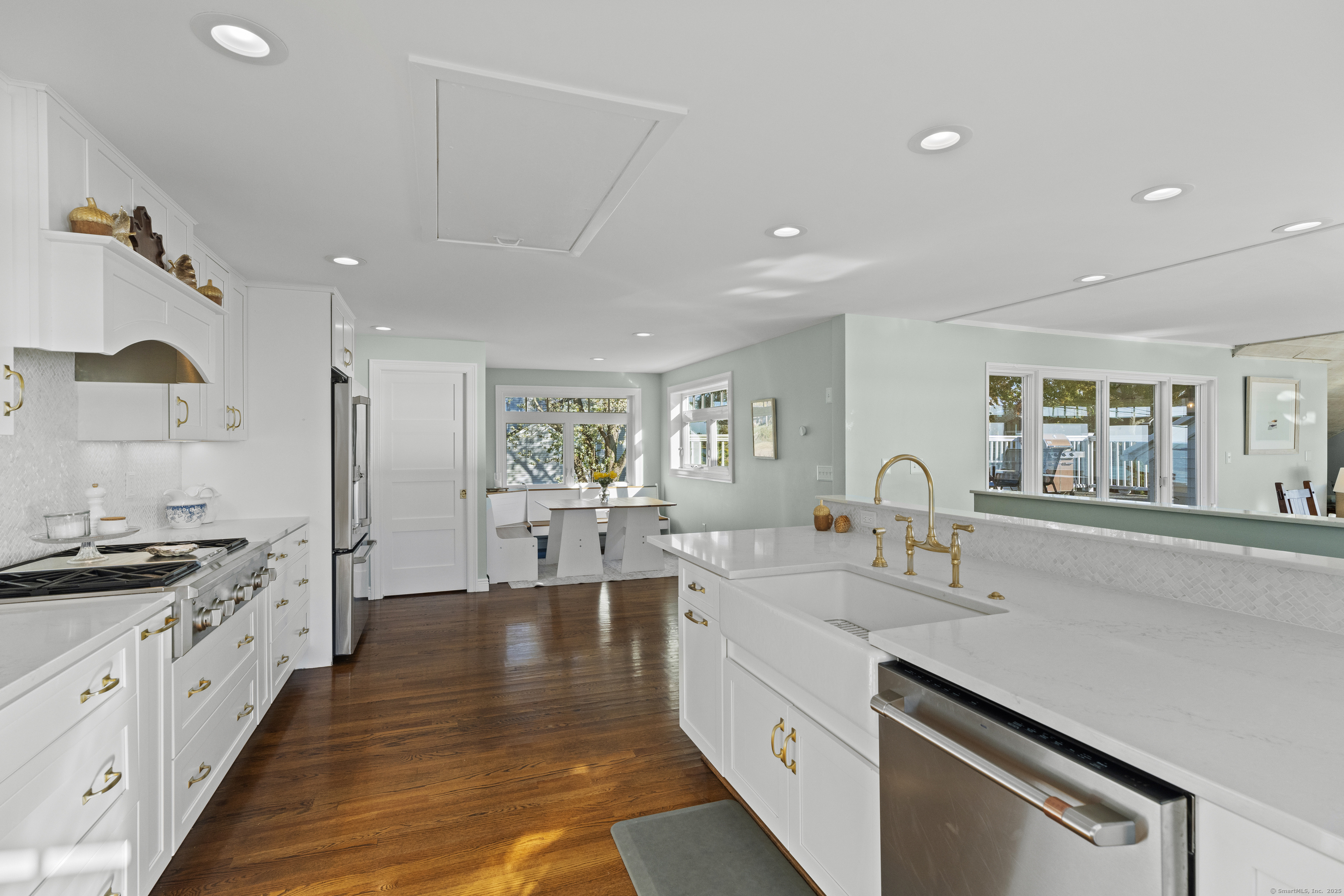 21 Harbor Street Branford, CT 06405 - Photo 18 of 40 a large kitchen with stainless steel appliances granite countertop a lot of counter space and wooden floors