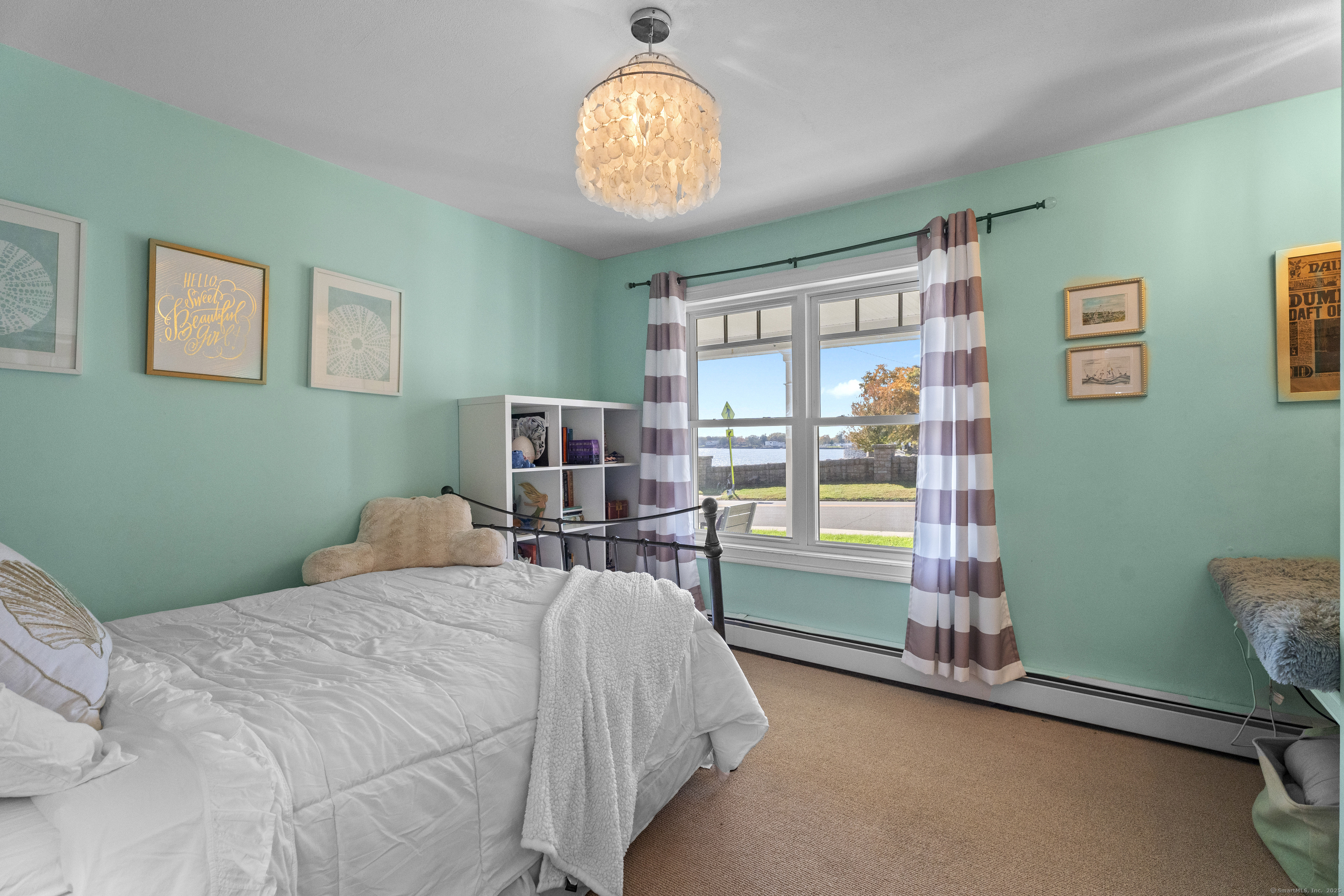 21 Harbor Street Branford, CT 06405 - Photo 25 of 40 a bedroom with a bed and a window