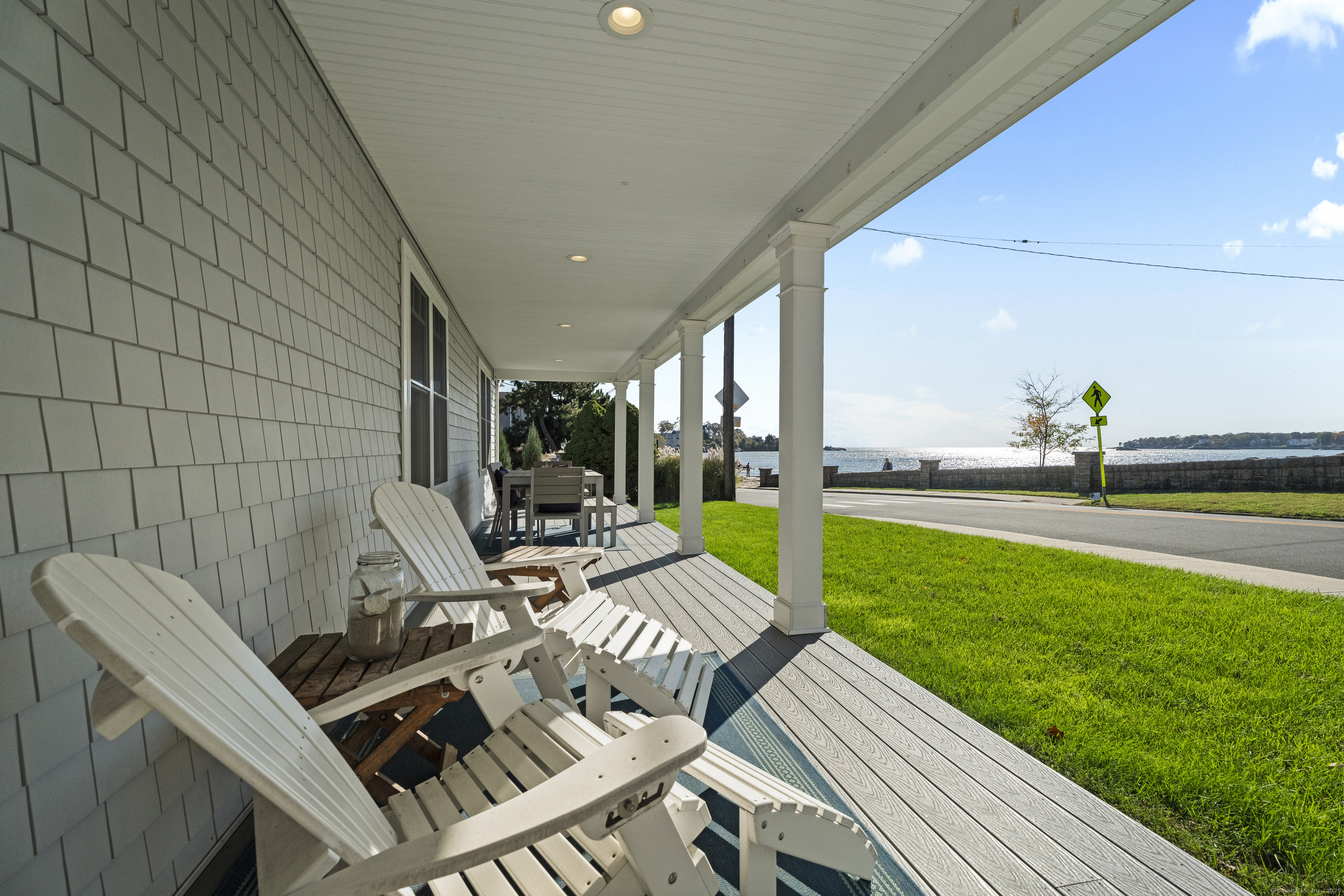 21 Harbor Street Branford, CT 06405 - Photo 5 of 40 a view of a patio with table and chairs and a barbeque
