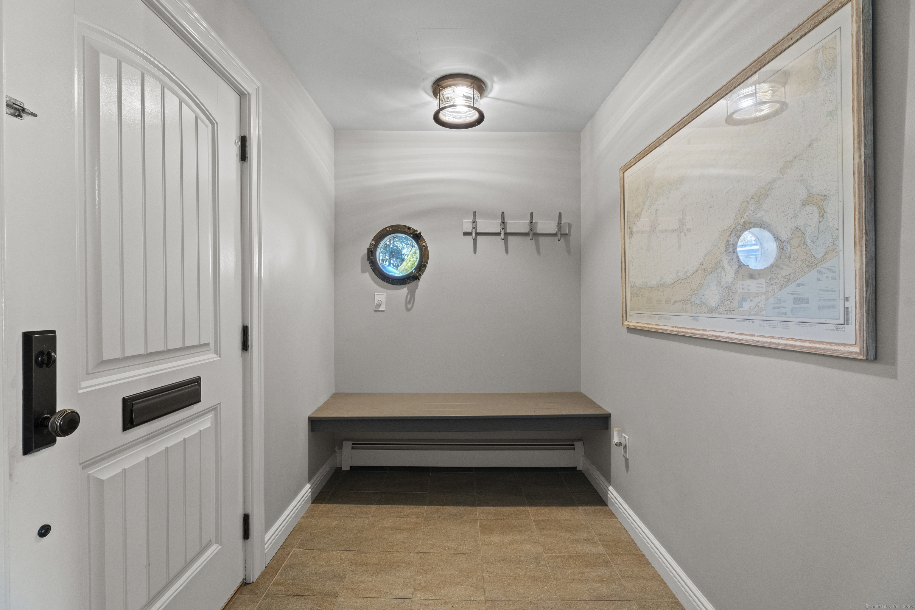 21 Harbor Street Branford, CT 06405 - Photo 6 of 40 a hallway with washer and dryer