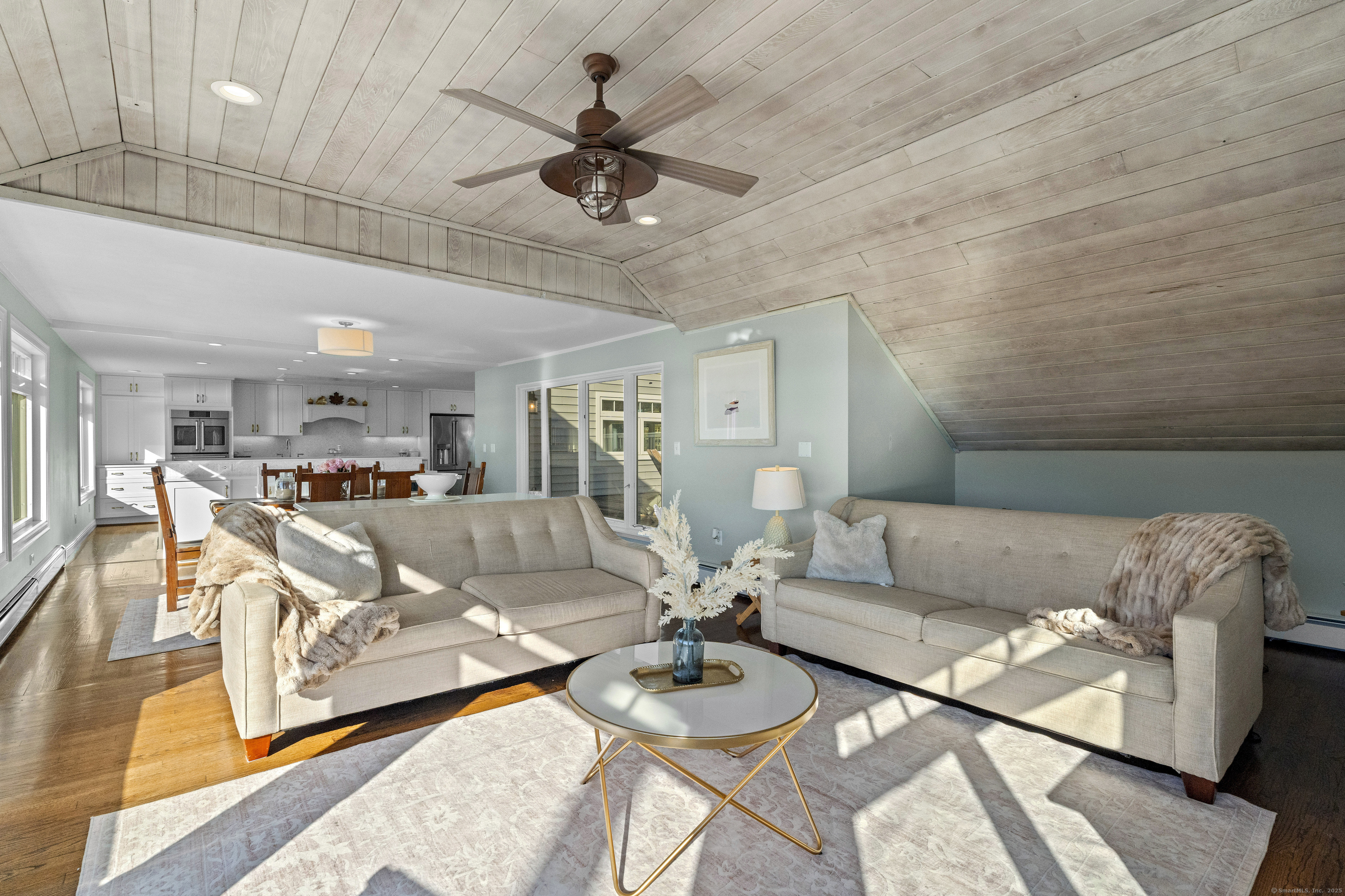 21 Harbor Street Branford, CT 06405 - Photo 10 of 40 a living room with furniture and a view of kitchen