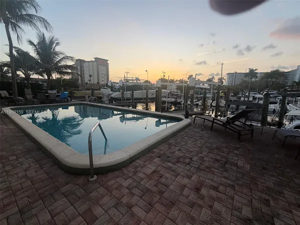 a view of a patio with swimming pool