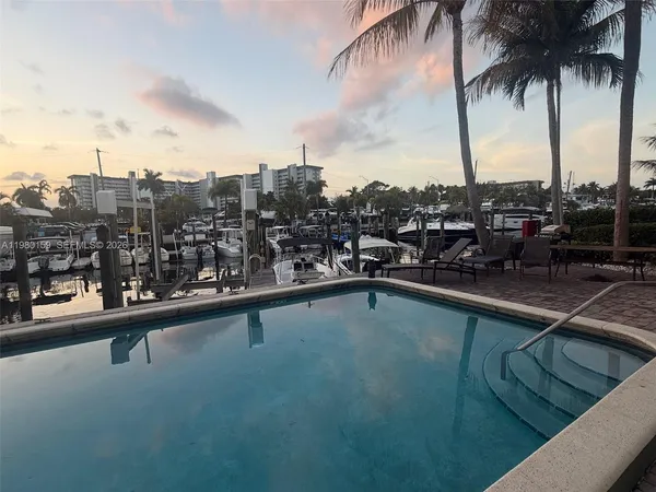 a view of a city with tall buildings and a bench