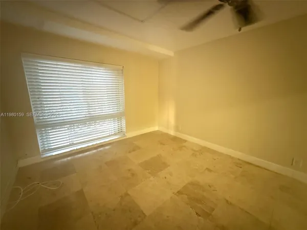 a view of empty room with a window