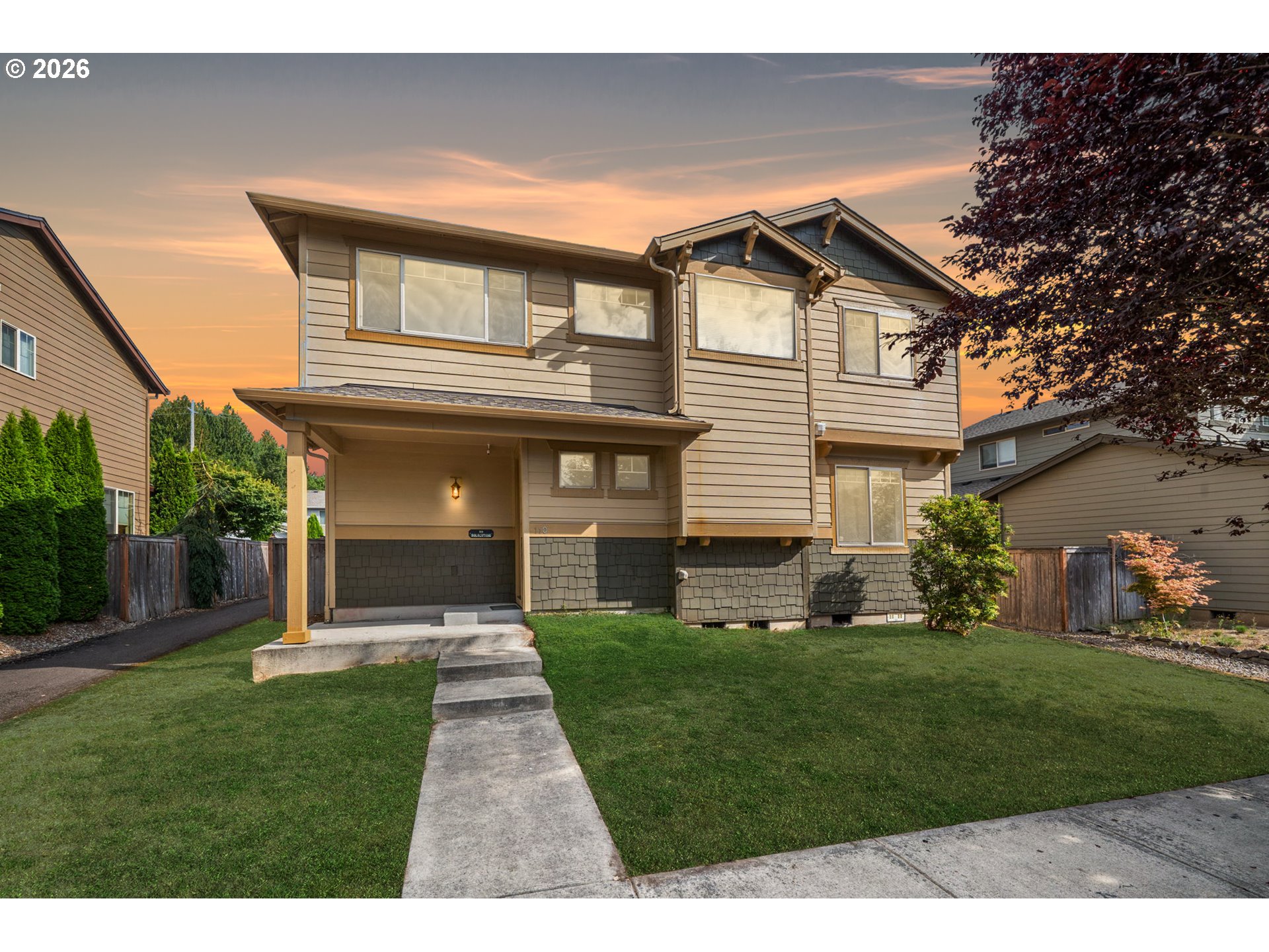 a view of house with a yard
