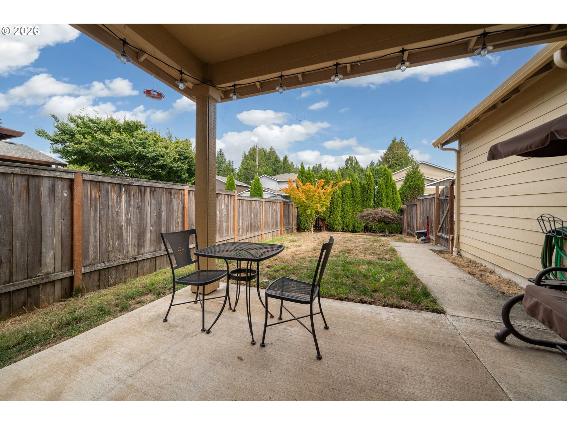 110 Northwest 24th Street Battle Ground, WA 98604 - Photo 17 of 20 a backyard of a house with table and chairs