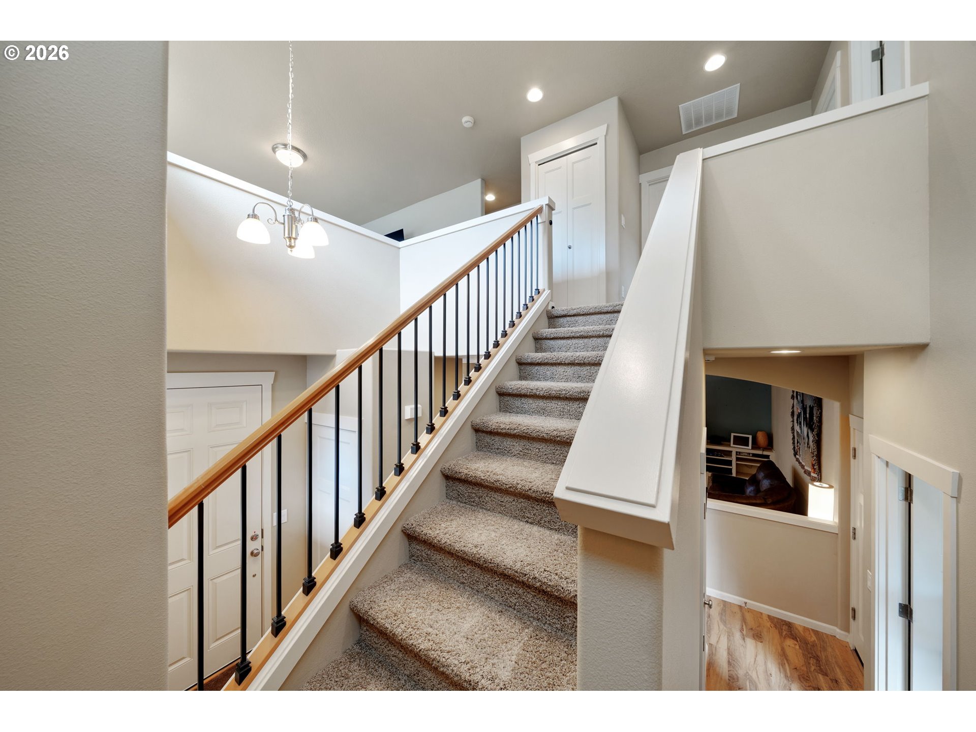 110 Northwest 24th Street Battle Ground, WA 98604 - Photo 8 of 20 a view of staircase with lots of frames and chairs