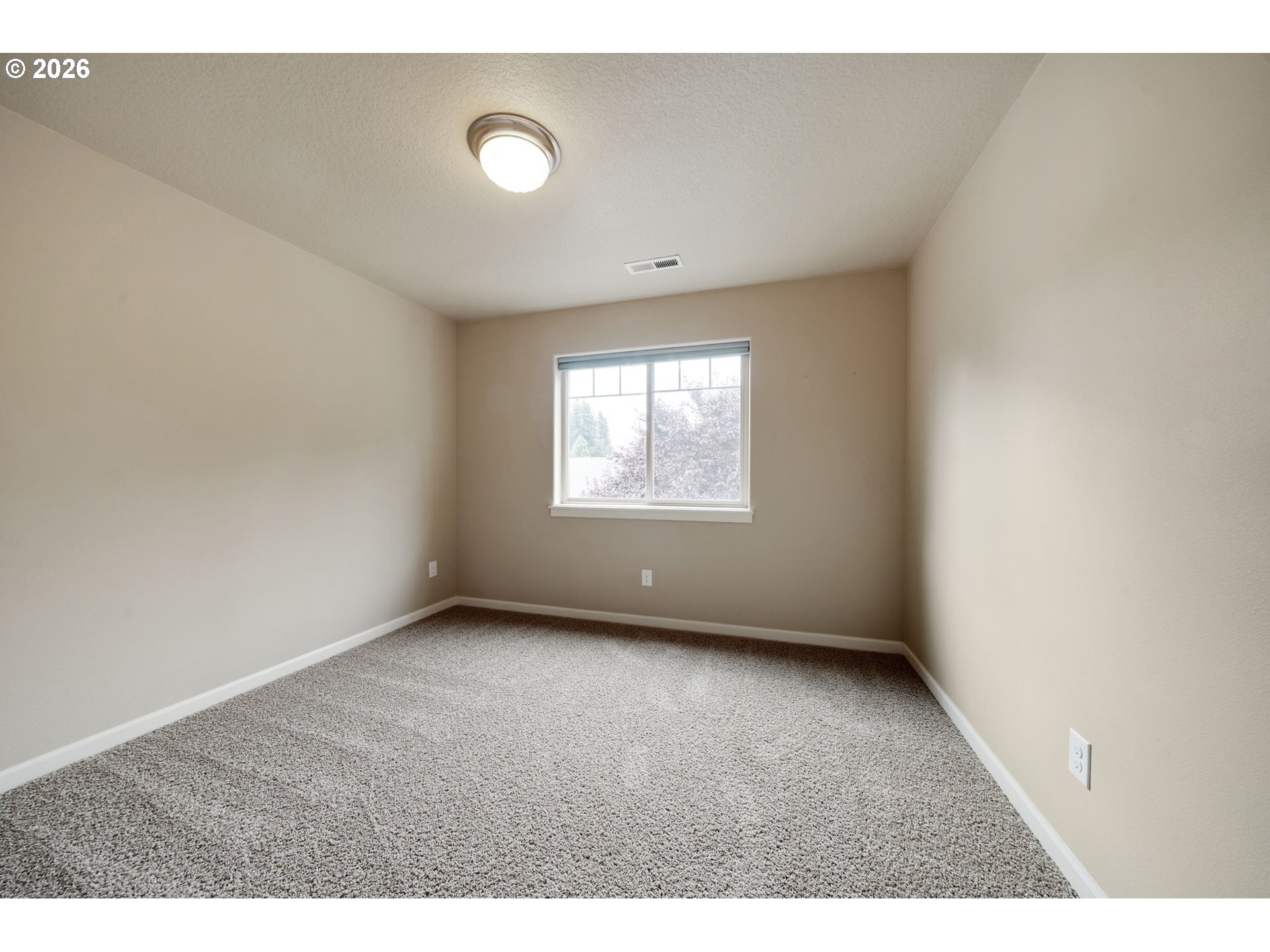 110 Northwest 24th Street Battle Ground, WA 98604 - Photo 10 of 20 a view of an empty room with a window